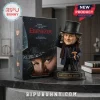 Ebenezer 2026 Limited Edition Sculpted Bobblehead beside its branded display box on a dark marble table.