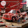 Eddie Van Halen brick-built truck and minifigure with striped red, white, and black pattern on a wooden workbench background.!