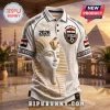 White polo shirt featuring gold pharaoh mask, Egypt soccer crest, 2026 text, and ancient hieroglyph patterns.!