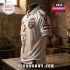 White polo shirt featuring a gold Egyptian pharaoh mask, Egyptian flag patch, and hieroglyphic patterns on a mannequin.!