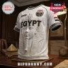 White Egypt soccer jersey featuring a pharaoh mask graphic, 2026 text, national emblems, and hieroglyphic sleeve patterns.!