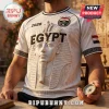 White Egypt soccer jersey featuring a large 3D-style pharaoh head print, hieroglyphics, and national flag emblem.!