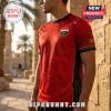 Red soccer jersey featuring Egyptian pyramid graphics, an ankh symbol, the year 2026, and an Egyptian national emblem.!