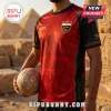 Red and black Egyptian-themed soccer jersey with pyramid graphics, Ankh symbol, and 2026 text worn by a man with a ball.!
