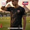 Black Egyptian-themed soccer jersey with gold Anubis chest graphic, Ankh sleeve detail, and 2026 text on field background.!