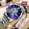 Elvis Presley wristwatch with stainless steel band, blue gradient dial, guitar graphic, and date window display.!