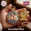 Gold-toned Elvis Presley pocket watch featuring a portrait, pink car, and American flag graphic on a red velvet surface.!