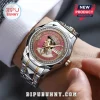 Elvis Presley commemorative watch with pink dial, gold crown, date window, and silver-tone diamond-encrusted bezel.!