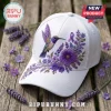 Embroidered Lavender Hummingbird Alzheimer’s Awareness Baseball Cap on wood with purple flower accents and awareness ribbon.