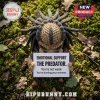 Crocheted Predator figure with dark yarn dreadlocks holding a sign reading Emotional Support The Predator.!