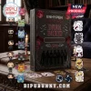 ENHYPEN Dark Blood box set featuring vinyl figures, bat-themed plush keychains, and vampire character stickers on a table.!