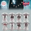 Enhypen tour custom sports jerseys featuring names, numbers, and member signatures on a textured grey and black background.!