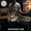 Person wearing a grey Enhypen baseball jersey with red graphic text, star accents, number 23, and flame patterns.!