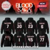 Black hoodies featuring Enhypen Blood Saga tour graphics with band member names, jersey numbers, and red sleeve patterns.!