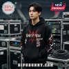 Young man wearing black hooded sweatshirt with red and white Enhypen Brought The Heat Back graphic print text.!