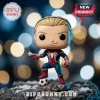 Spider-Man vinyl figure wearing blue and red suit with one foot on a soccer ball against a blurred bokeh background.!
