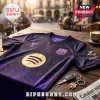 FC Barcelona purple jersey with gold Spotify logo, snakeskin texture, and FCB crest on a wooden table with keys.!