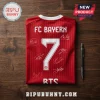 Red FC Bayern Munich soccer jersey, number 7, featuring white player signatures on a wood grain background.!