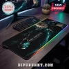 Final Fantasy VII RGB gaming mouse pad with Cloud Strife artwork on a dark wood desk with keyboard and monitor.!