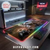 Final Fantasy VII Sephiroth rectangular RGB LED gaming mouse pad on a dark wood desk with a controller and keyboard.!