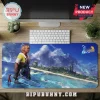Final Fantasy X gaming mouse pad featuring Tidus on a beach with a blue ocean and 25th anniversary logo on wooden desk.!