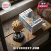 Final Fantasy Tidus vinyl figure on circular black base next to its product box featuring 25th anniversary branding.!