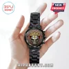 Five Finger Death Punch matte black metal wristwatch featuring a skull graphic and FDP logo on a red patterned face.!