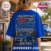 Blue t-shirt showing a vintage Ford truck graphic with text Celebrating 123 Years of Ford 1903-2026 and fireworks design.!