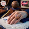 Gold championship ring featuring French Football Federation logo on a document with a soccer ball trophy in background.!