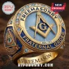 Freemason 1717 Square and Compasses Signet Ring with gold finish, blue enamel, and blue stone accents on a wooden surface.