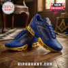 Blue and gold Freemason themed sneakers with square and compass symbols on a hardwood floor background.!