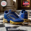 Blue and gold sneakers with Masonic square and compass symbols and the text Freemasonry on a checkered marble floor.!