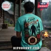 Turquoise t-shirt featuring Camp Crystal Lake horror movie graphics with Jason Voorhees, forest, and lifesaver imagery.!