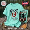 Mint green graphic t-shirt featuring Friday the 13th Jason Voorhees theme, Camp Crystal Lake text, and horror illustrations.!
