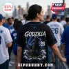 Godzilla Minus One Los Angeles Dodgers black baseball jersey featuring a monster graphic and Japanese kanji lettering.