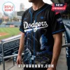 Godzilla Minus One Los Angeles Dodgers black baseball jersey featuring a monster graphic, stadium, and blue piping.