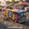 Grateful Dead tie-dye bus toy model with dancing bear graphics and three musician minifigures on an asphalt background.!