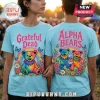 Light blue t-shirts featuring Grateful Dead tie-dye bear graphics, rainbows, butterflies, and floral borders.!