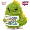 Green crochet dinosaur plush holding a sign reading Always be yourself unless you can be a dinosaur. You are RAWRsome.!