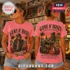 Pink Guns N' Roses t-shirt featuring Axl Rose and skull illustrations on a woman in a vinyl record shop setting.!