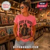 Woman wearing a bright pink Guns N' Roses band graphic t-shirt featuring Axl Rose in a music record store.!