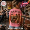 Pink t-shirt with Guns N' Roses graphic featuring a skeleton playing guitar on a beach inside a rustic bar setting.!