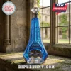 Blue glass Halo Master Chief whiskey bottle with lightning engravings and Master Chief helmet base, standing on stone sill.!