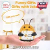 Small crochet bee plush toy with yellow and black yarn, holding a sign that says BEE Yourself, held in a human hand.!