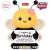 Yellow and black crochet bumblebee plush holding a white sign that says Happy Birthday you deserve all the best.!