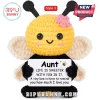 Crochet bee plush toy with yellow head, black body, pink flower, and white sign reading Aunt Life is sweeter with you.!