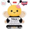 Crochet bee plush toy with black and yellow yarn, pink flower accessory, and white sign reading Niece and heartfelt text.!