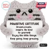Grey crochet cat plush holding a sign that reads Pawsitive Cattitude and lists motivational affirmations.!