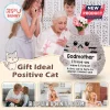 Grey crochet plush cat holding a sign that reads Godmother I'll love you meow and forever with a sad expression.!