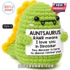 Green crochet dinosaur plush holding a sign that reads Auntsaurus RAWR means I love you in Dinosaur.!
